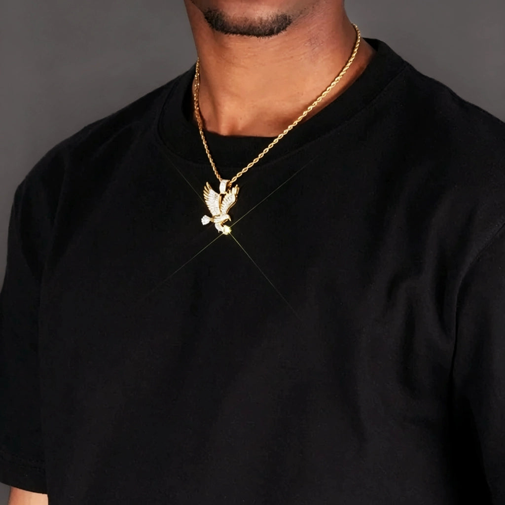 33mm Iced Victory Eagle Pendant gold plated cubic zirconia eagle necklace with sparkle light effect worn on male model gold rope chain black t‑shirt hip hop street style close‑up wearing shot bling rapper statement jewelry RDRIP JEWELRY
