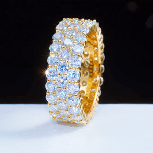 18K gold plated genuine 925 sterling silver 3 row cluster moissanite eternity ring shot under soft studio lighting on clean white flat surface, densely hand‑set D‑color VVS1 plus 4mm round hearts and arrows moissanite stones, 8mm wide iced‑out full band hip hop unisex statement ring, bright sparkling light flares, hollow inner band structure, GRA certified moissanite bling jewelry for men and women RDRIP JEWELRY
