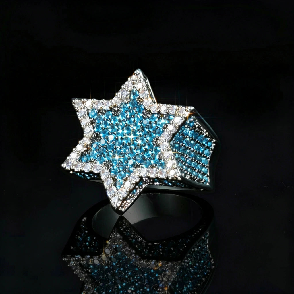 3D iced two‑tone star of david franklin ring for men, hip hop rapper statement jewelry, hand‑set vibrant blue and white aaa cubic zirconia stones, 18k gold plated metal, hexagram star icy bling ring with blue center stones, shot on glossy black reflective background, luxury urban mens fashion ring RDRIP JEWELRY
