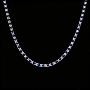 Full‑length flat view of 4mm Iced Out Blue and White Alternating Tennis Chain, full strand shot of hand‑set VVS sapphire‑blue and white round simulated diamond two‑tone hip hop necklace against solid black background RDRIP JEWELRY
