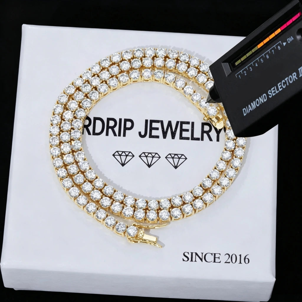 4MM VVS1 D‑Color Moissanite Tennis Chain 925 Sterling Silver 18K Gold Plated being tested with handheld diamond selector tester, hip hop iced out tennis chain necklace, brilliant fire sparkle moissanite stones passes diamond tester, premium hip‑hop jewelry displayed on branded gift box RDRIP JEWELRY
