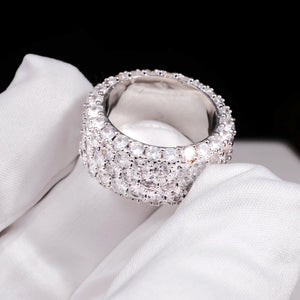 RDRIP JEWELRY 5‑Row Fully Paved Iced Out Eternity Ring silver‑tone close‑up shot, single white gold plated hip hop band ring resting on soft white cotton glove, heavy 14mm width prong‑set construction, full‑circle hand‑set flawless VVS simulated diamonds, brilliant multi‑angle sparkle, detailed inner band view, icy bling statement hip‑hop jewelry for men women, Prong Cuban family wide eternity ring
