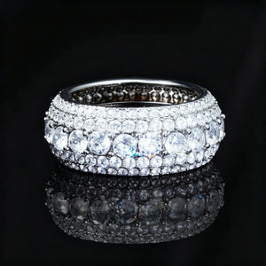 5‑Row Iced‑Out Full‑Paved Eternity Band Ring silver tone heavy width men hip hop ring fully paved round cubic zirconia hand set icy bling jewelry black background mirror reflection product shot RDRIP JEWELRY
