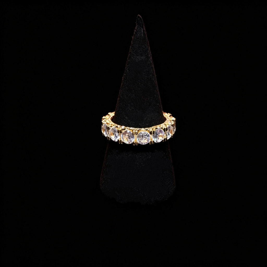 18k gold plated 5mm width iced out round full eternity ring bold prong set aaa cubic zirconia full band ring displayed on black velvet ring stand pure black background hip hop unisex icy stacking jewelry RDRIP JEWELRY
