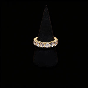 18k gold plated 5mm width iced out round full eternity ring bold prong set aaa cubic zirconia full band ring displayed on black velvet ring stand pure black background hip hop unisex icy stacking jewelry RDRIP JEWELRY
