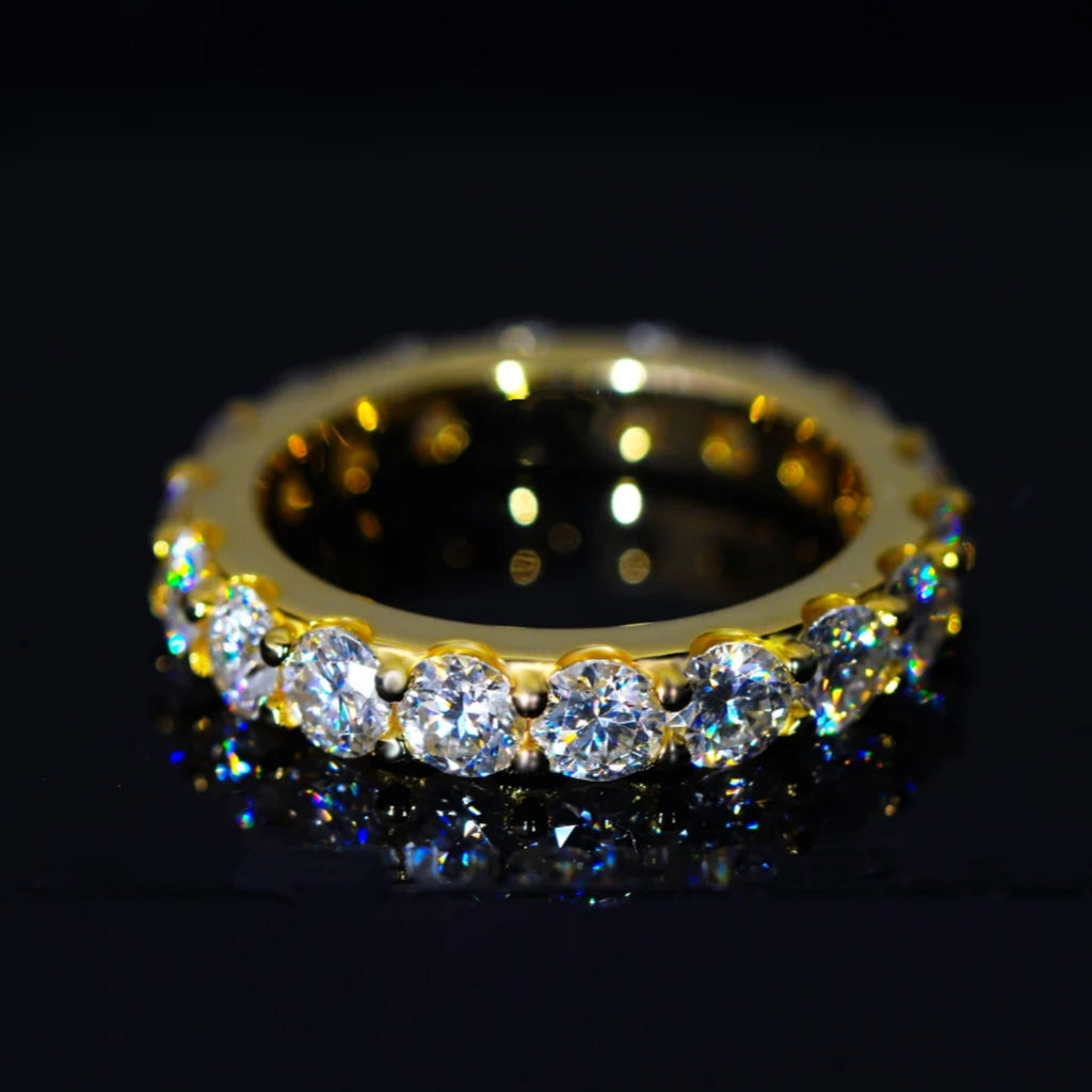 6.00 CARAT S925 VVS1+ moissanite single‑row full eternity ring 4mm round ideal cut hearts and arrows moissanite stones, premium 18K gold plated genuine 925 sterling silver band, brilliant icy sparkling stones with light reflection on dark glossy reflective surface, hip‑hop wedding stackable full band ring unisex luxury bling fine jewelry product close‑up shot RDRIP JEWELRY