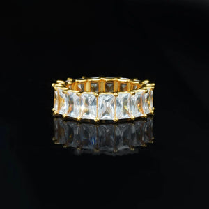 7mm baguette eternity ring 925 silver iced out hip‑hop band, full around rectangular baguette cut cubic zirconia mens ring, gold plated bling statement hiphop jewelry, black reflective studio background RDRIP JEWELRY
