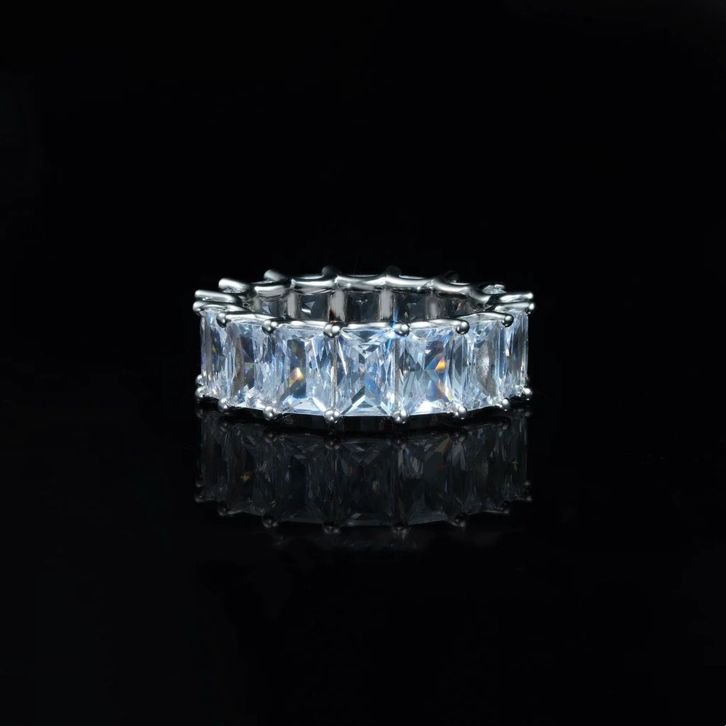 7mm baguette eternity ring 925 silver white gold plated iced out hip hop band, full around rectangular baguette cut cubic zirconia mens ring, silver tone bling statement hiphop jewelry, black reflective studio background RDRIP JEWELRY
