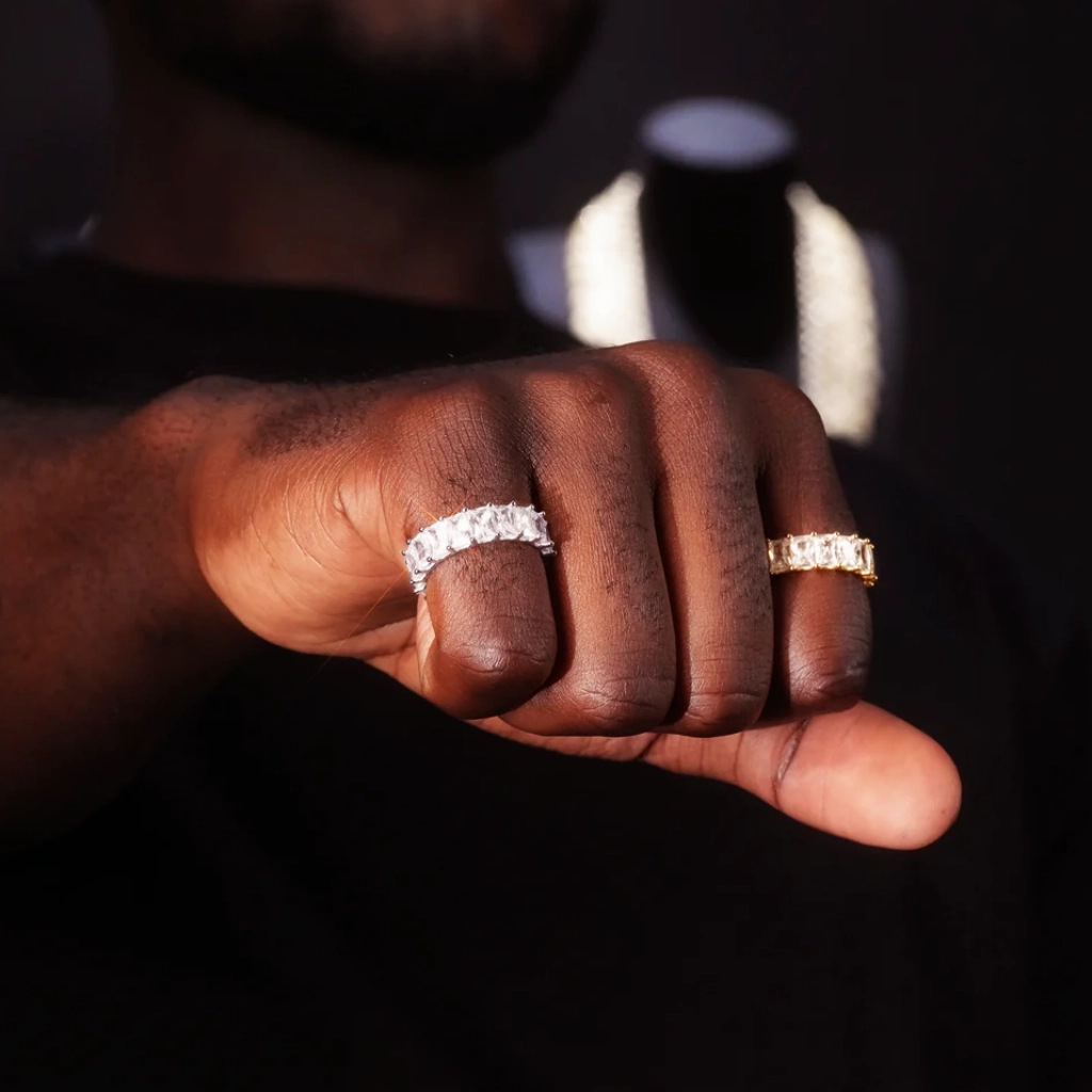 7mm baguette eternity ring 925 silver iced out hip hop band, white gold and gold plated version displayed on mens hand, full baguette cut cubic zirconia ring, real wear lifestyle shot hiphop bling jewelry RDRIP JEWELRY
