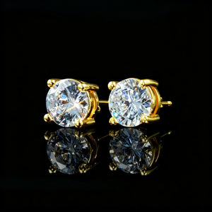 Close-up shot of 8mm Iced Brilliant Cut 4-Prong Gold Stud Earrings, shiny round moissanite solitaire studs with reflection, black background hip hop jewelry RDRIP JEWELRY
