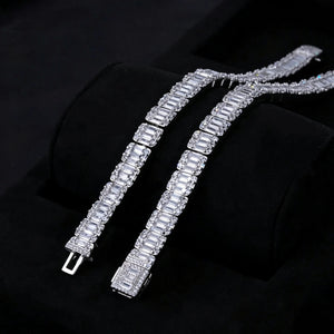 Closeup view of two 8mm  width iced baguette cluster tennis bracelets, showcasing ornate stone‑encrusted lock clasp, flawless VVS simulated baguette cluster diamonds with brilliant starburst sparkle and long light flare effects, white gold plated copper hip hop bling bracelets arranged on black velvet display tray, premium iced‑out unisex hip‑hop wrist jewelry RDRIP JEWELRY