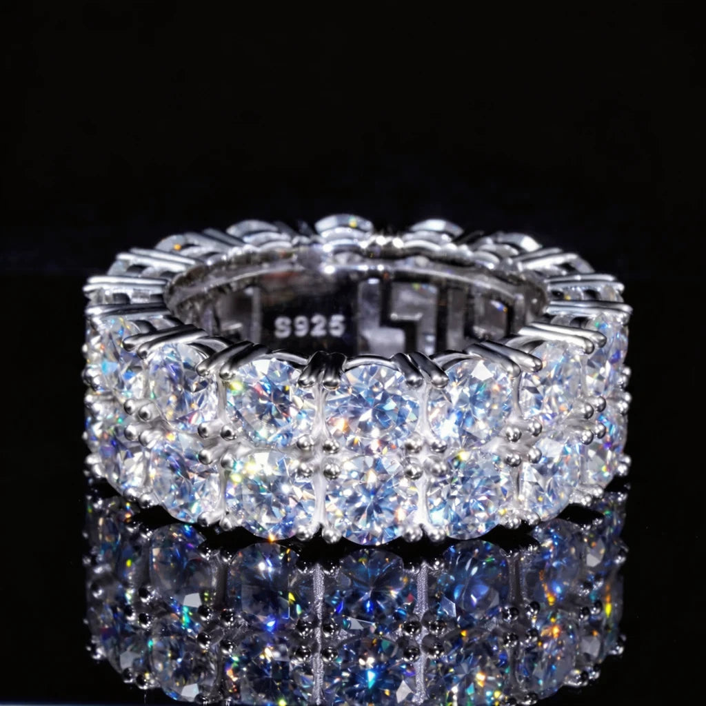 Black background product shot of 9mm double row round D-color VVS1 moissanite full eternity band ring for men, hand-set hearts and arrows ideal cut moissanite stones, genuine 925 sterling silver white gold plated icy hip-hop bling ring, sparkling high-refraction moissanite stones with bright starburst light and long fiery flashes, luxury mens hip-hop finger band displayed on dark reflective surface, premium statement jewelry from RDRIP JEWELRY
