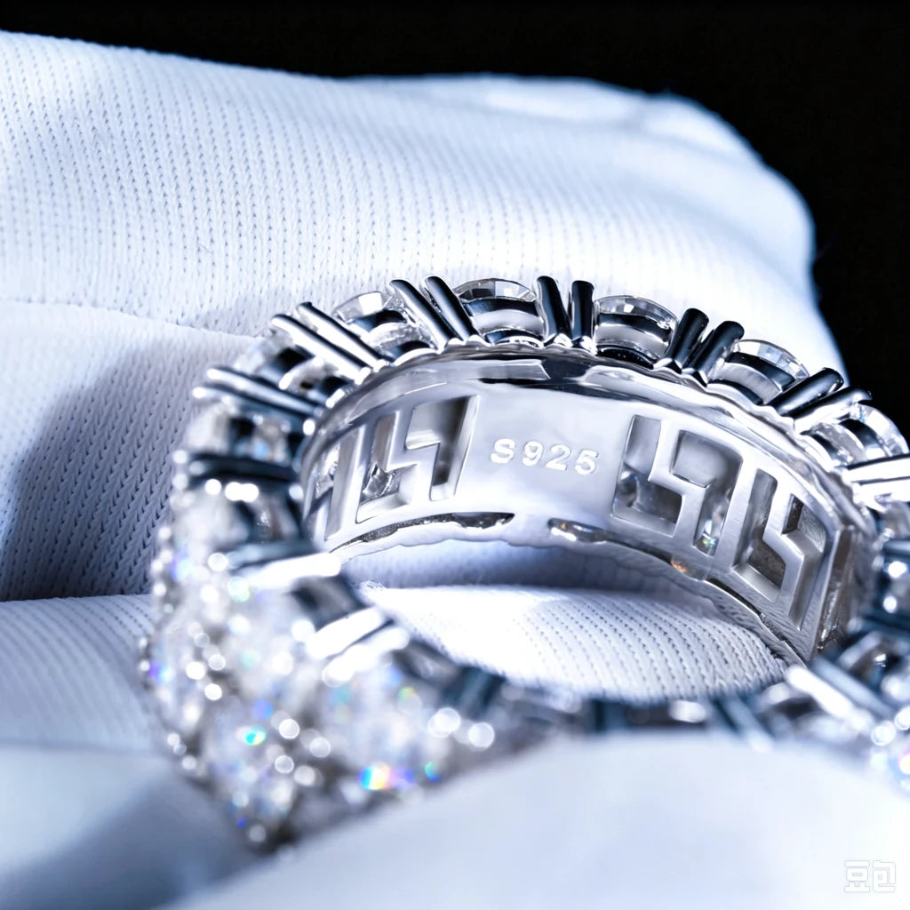 Inner engraving detail shot of 9mm double‑row round D‑color VVS1 moissanite full eternity band ring for men, displaying S925 sterling silver stamp inside band, hollow cut‑out inner structure, hand‑set hearts and arrows moissanite stones with bright sparkling fire flashes, white gold plated icy hip‑hop bling ring held in white microfiber gloves, premium mens hip‑hop statement jewelry close‑up inner view from RDRIP JEWELRY
