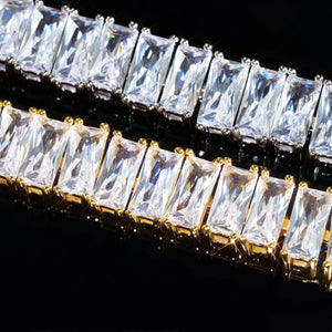 Blaze Retro Baguette‑Cut Iced Tennis Bracelet extreme macro gem close‑up, 18k gold plated and silver‑toned prong setting, hand‑set brilliant rectangular baguette‑cut AAA cubic zirconia stones, showcasing stone sparkle, crystal fire and detailed metal prong craftsmanship against deep black background, premium men unisex hip‑hop iced‑out bling jewelry RDRIP JEWELRY
