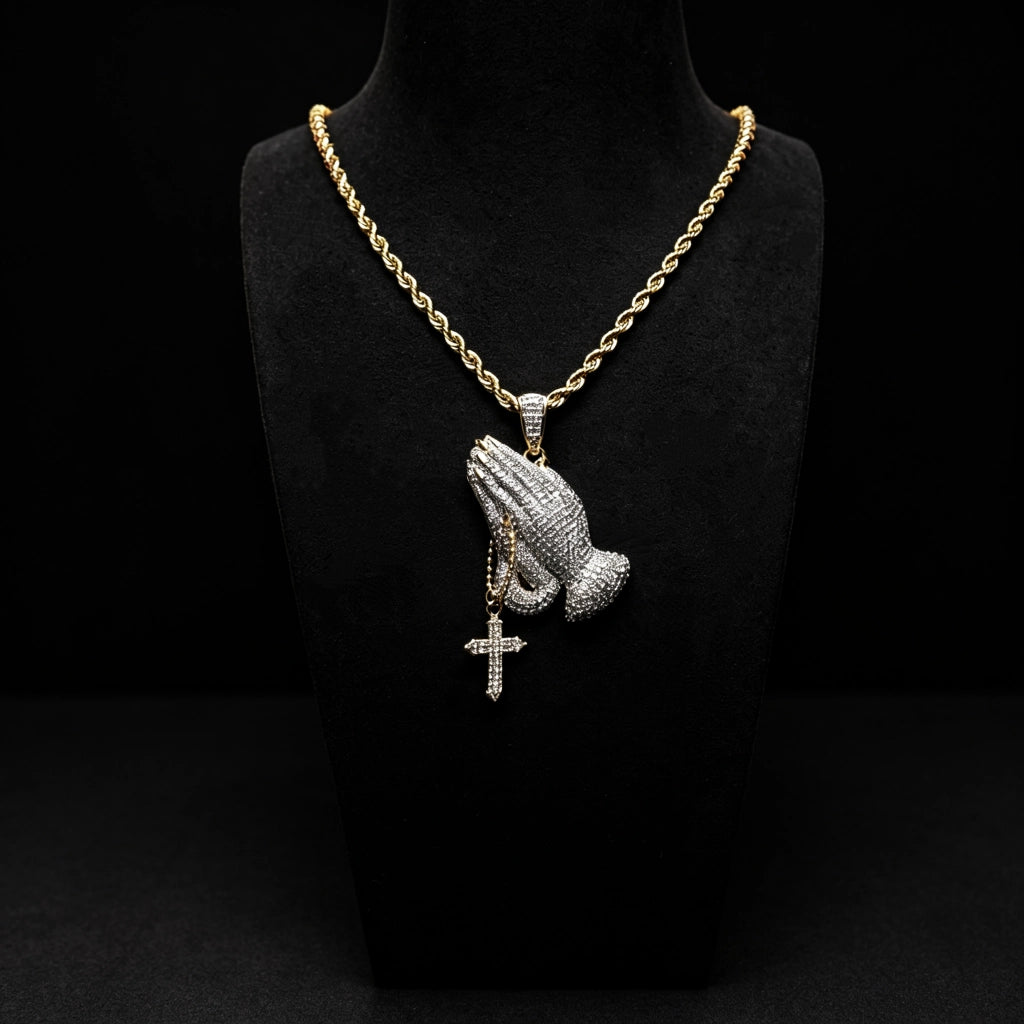 Iced two tone blessing praying hands pendant with dangling cross displayed on black mannequin bust, flawless VVS simulated diamonds paved copper 18k gold plated rope chain necklace, faith inspired men hip hop bling streetwear jewelry RDRIP JEWELRY
