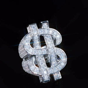 RDRIP JEWELRY Dollar Tycoon hollow double US dollar sign ring, iced‑out full paved AAA cubic zirconia stones, interlocked double dollar symbol hip hop men statement ring, heavy bling rapper jewelry shot on solid black background
