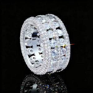 RDRIP JEWELRY full iced double rows hollow silver tone men ring side close up view,copper base hip hop wide band ring with brilliant bling rhinestones,exposed hollow inner structure design,sparkling stone flare effect,black background with mirror reflection product photography

