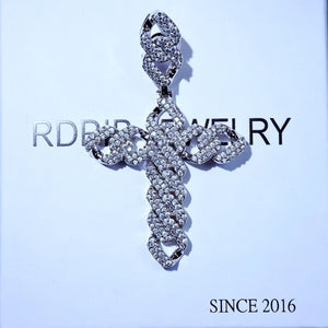 Full Paved Cuban Chain Style Cross Pendant top‑down flat lay product shot, close‑up view of iced out AAA cubic zirconia cross charm, mens hip hop religious bling jewelry silver finish placed on RDRIP branded paper background RDRIP JEWELRY
