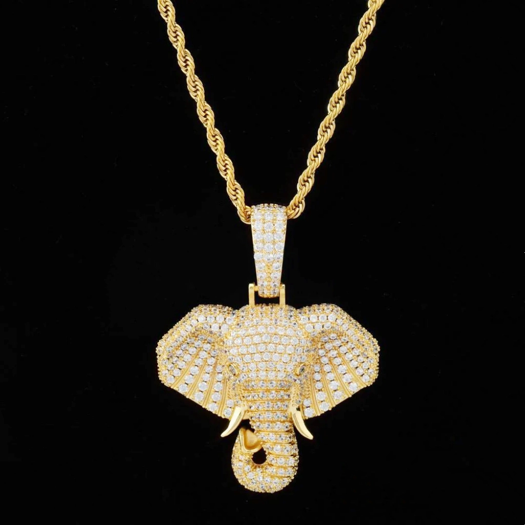 Straight front flat studio shot of 18k gold plated iced micro paved pharaoh elephant head pendant necklace, full AAA cubic zirconia stone coverage, matched with gold rope chain, clean solid pure black background, hip hop men statement elephant charm jewelry RDRIP JEWELRY
