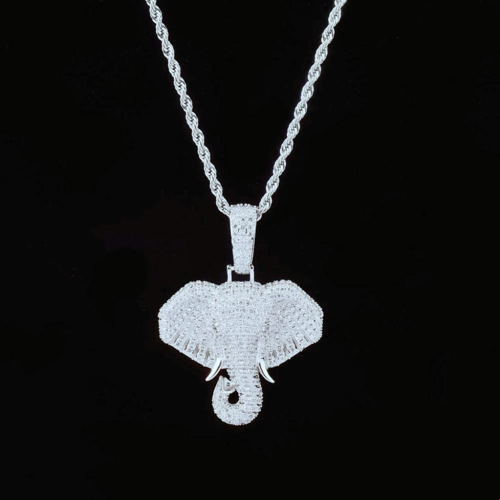 Front studio shot of silver finish iced micro paved pharaoh elephant head pendant necklace, fully encrusted with AAA cubic zirconia stones, paired with silver rope chain, clean solid black background, hip hop mens iced out elephant charm street jewelry RDRIP JEWELRY

