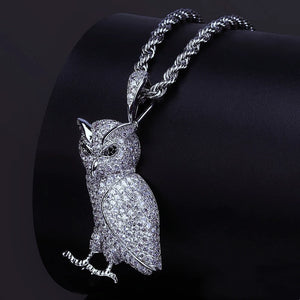 Iced Out Full Pave 3D Owl Pendant paired with twisted rope chain, fully encrusted micro pave cubic zirconia owl charm, close up shot on curved black leather display cushion, premium hip hop bling animal pendant necklace for men RDRIP JEWELRY
