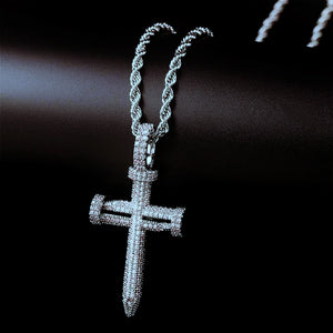 Hanging view silver tone Iced Out Nail Cross Pendant, full pave AAA cubic zirconia nail shaped crucifix pendant for men, paired with twisted rope chain displayed on smooth dark black background RDRIP JEWELRY
