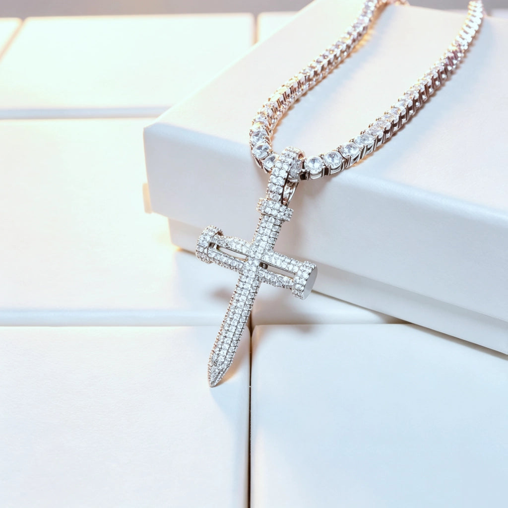 Iced Out Nail Cross Pendant full pave AAA cubic zirconia silver tone nail shaped crucifix necklace for men, bling iced‑out hip hop street wear jewelry matched with tennis chain displayed on clean white gift box background RDRIP JEWELRY
