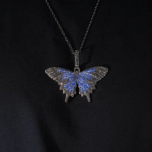 Micro‑pave iced out blue black butterfly pendant necklace black gunmetal finish matched with black rope chain full paved flawless VVS simulated diamonds hip hop bling jewelry flat lay studio photo RDRIP JEWELRY
