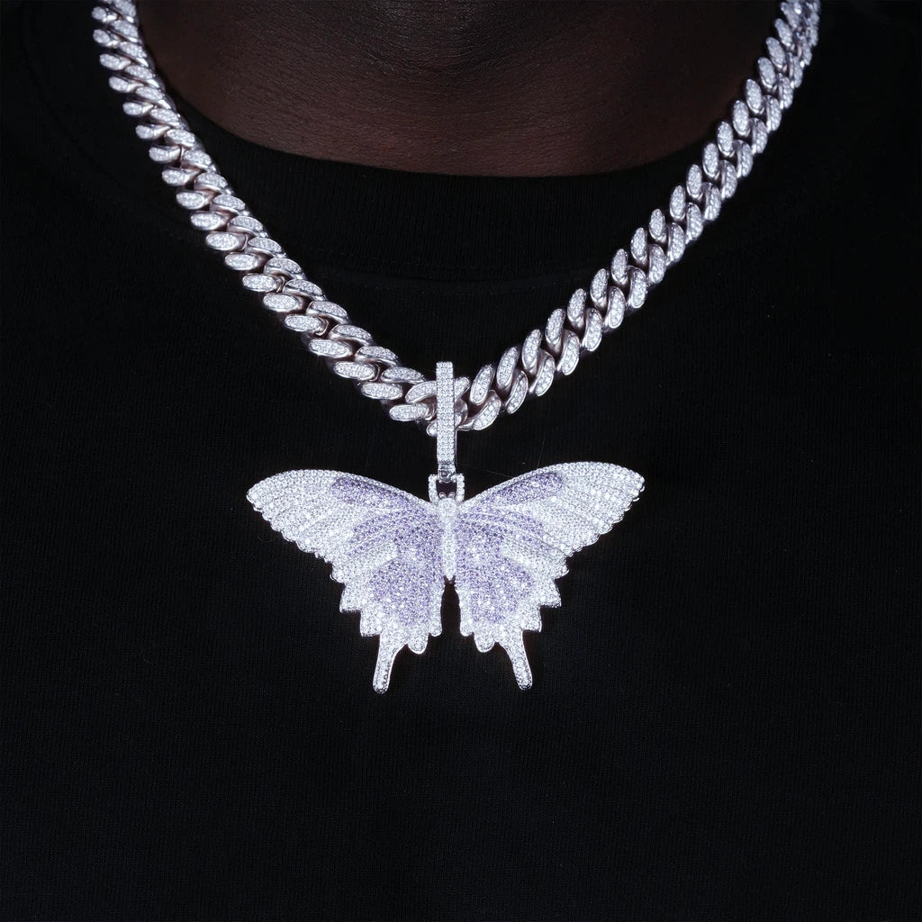 Micro‑pave iced out purple white butterfly pendant necklace worn on model with miami cuban chain white gold finish full paved flawless VVS simulated diamonds hip hop street lifestyle wearing shot for men RDRIP JEWELRY

