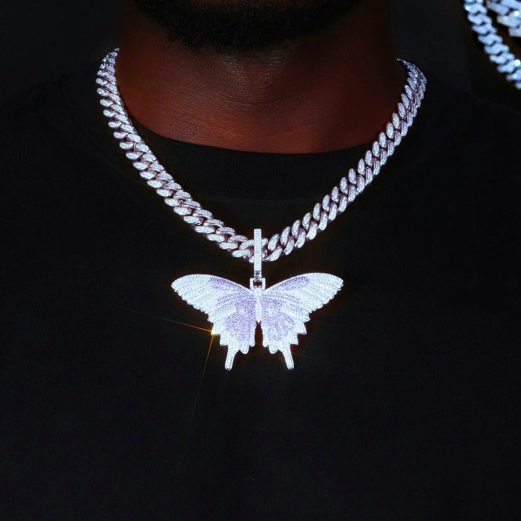 Micro‑pave iced out purple white butterfly pendant necklace white gold finish sparkling glare effect worn on model with iced miami cuban chain flawless VVS simulated diamonds dark background hip hop street jewelry wearing shot RDRIP JEWELRY
