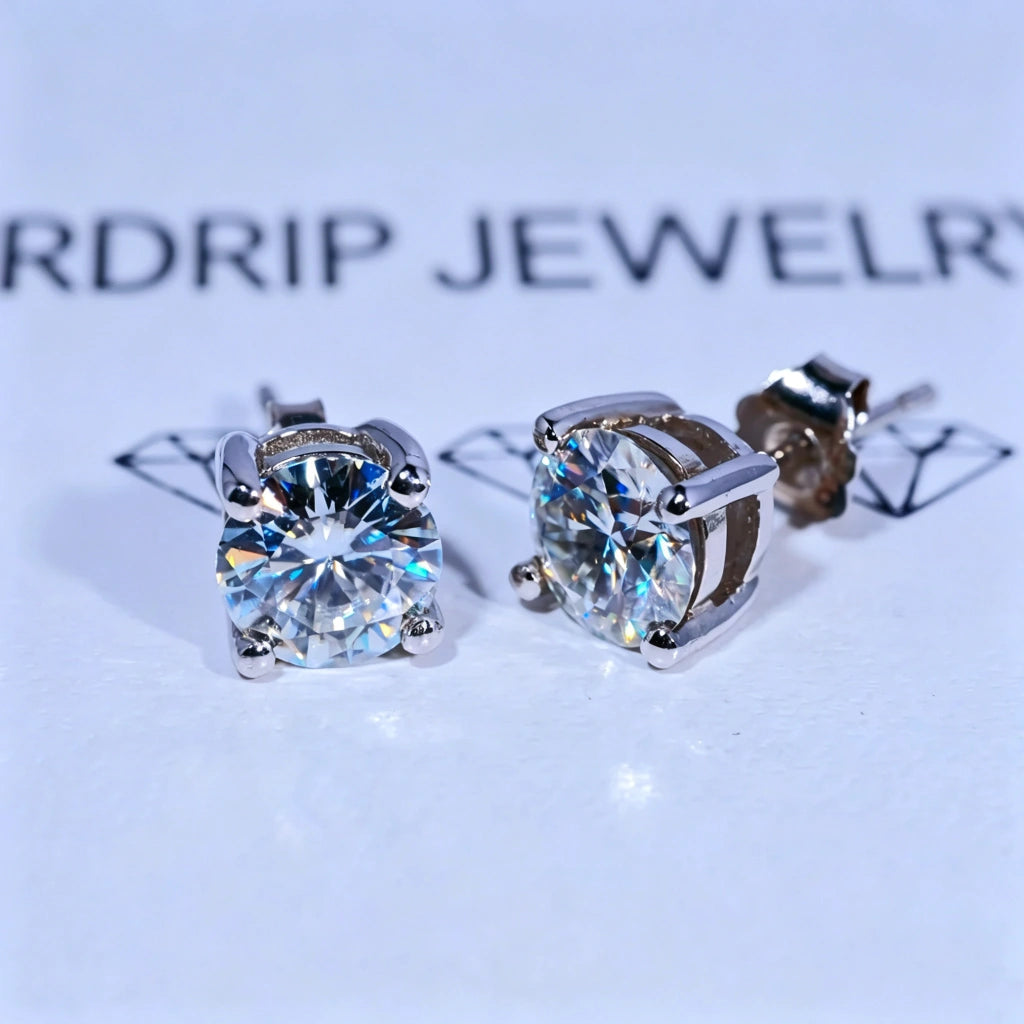Minimalist Solitaire Round Moissanite Stud Earrings, 4-prong setting D-E color VVS1 hearts and arrows round moissanite, 925 sterling silver white gold plated screw back unisex hip hop single stone earrings against branded white background RDRIP JEWELRY
