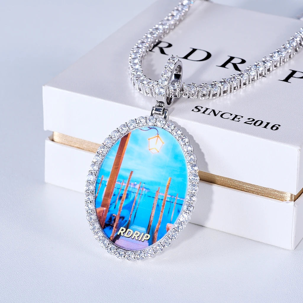 Front view of Oval Round Halo Custom Photo Pendant, personalized custom picture medallion encircled with sparkling stones, RDRIP branded hip hop photo necklace matched with icy tennis chain