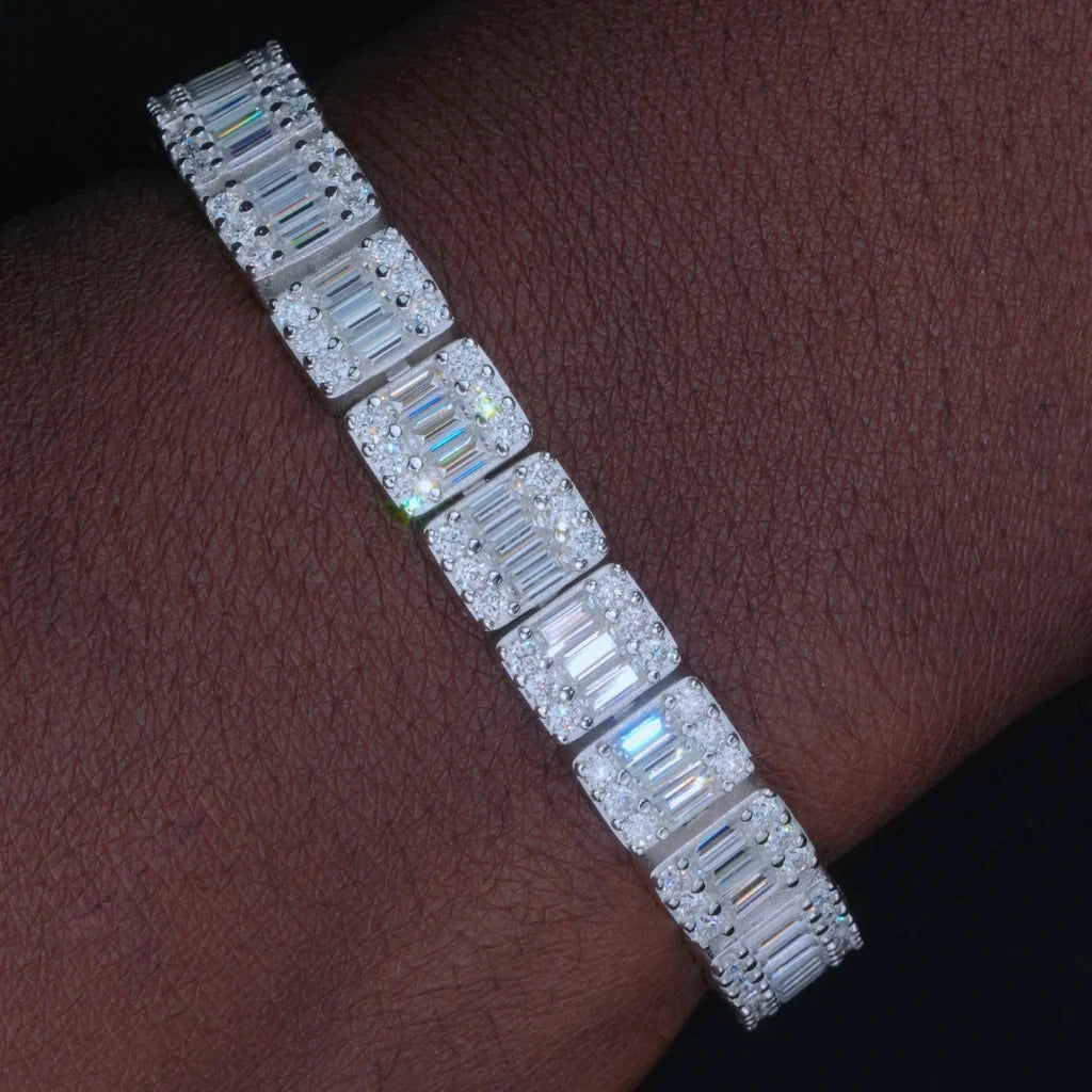 Closeup real wear photo of single 8mm rectangular baguette cut VVS1+ D color moissanite tennis bracelet fitted on dark brown men's wrist skin, solid genuine S925 sterling silver construction with white gold plated and 18K gold plated finish, each square link embedded with center baguette moissanite surrounded by round brilliant moissanite stones with bright rainbow fire icy shine, hand prong set craft prevents stone falling out, tarnish resistant streetwear stacking wrist jewelry for hip hop rappers
