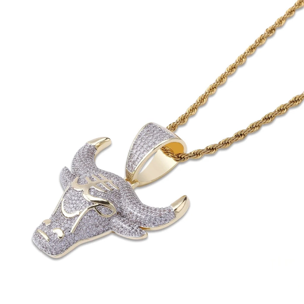 Angled close‑up studio shot of two tone 18k gold plated iced out bull head pendant, detailed micro paved cubic zirconia stones, showing pendant bail structure with gold twist rope chain, textured icy hip hop ox charm mens jewelry RDRIP JEWELRY SINCE 2016
