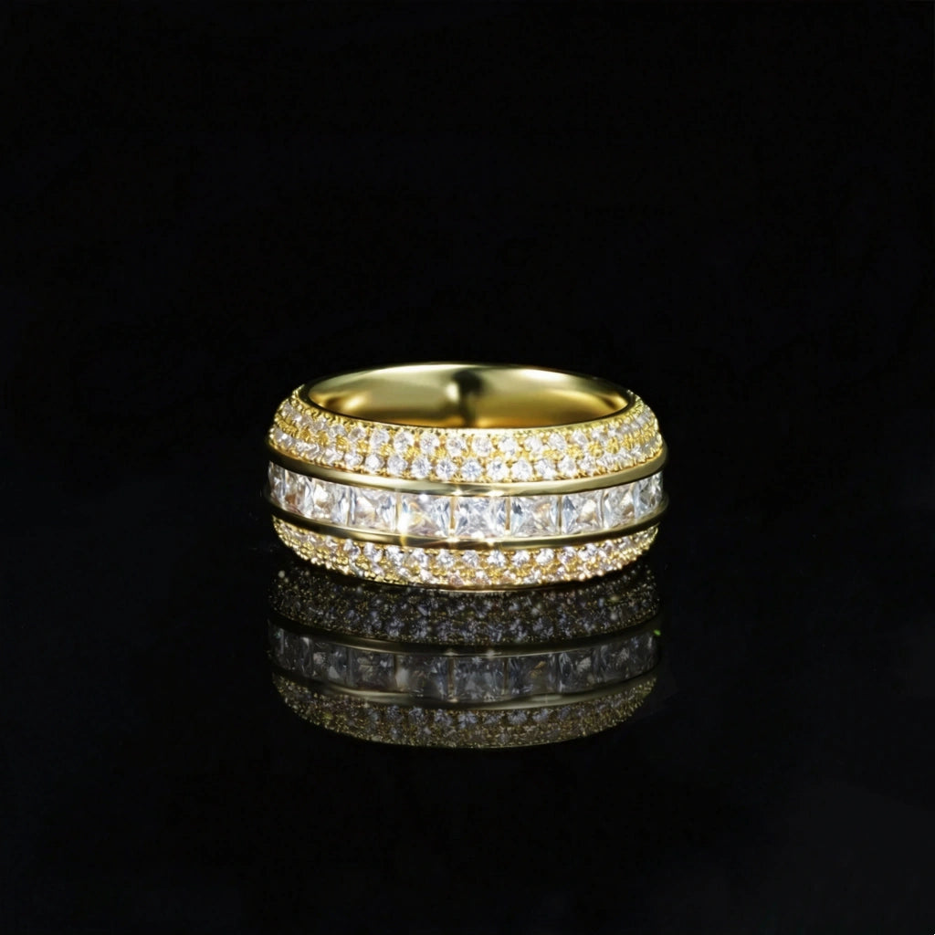 Front view shot of gold baguette princess cut triple band spinner eternity ring for men, hand set aaa cubic zirconia with micro pave surrounding stones, wide iced out hip hop band ring displayed on glossy black reflective surface, premium bling mens fashion jewelry RDRIP JEWELRY SINCE 2016
