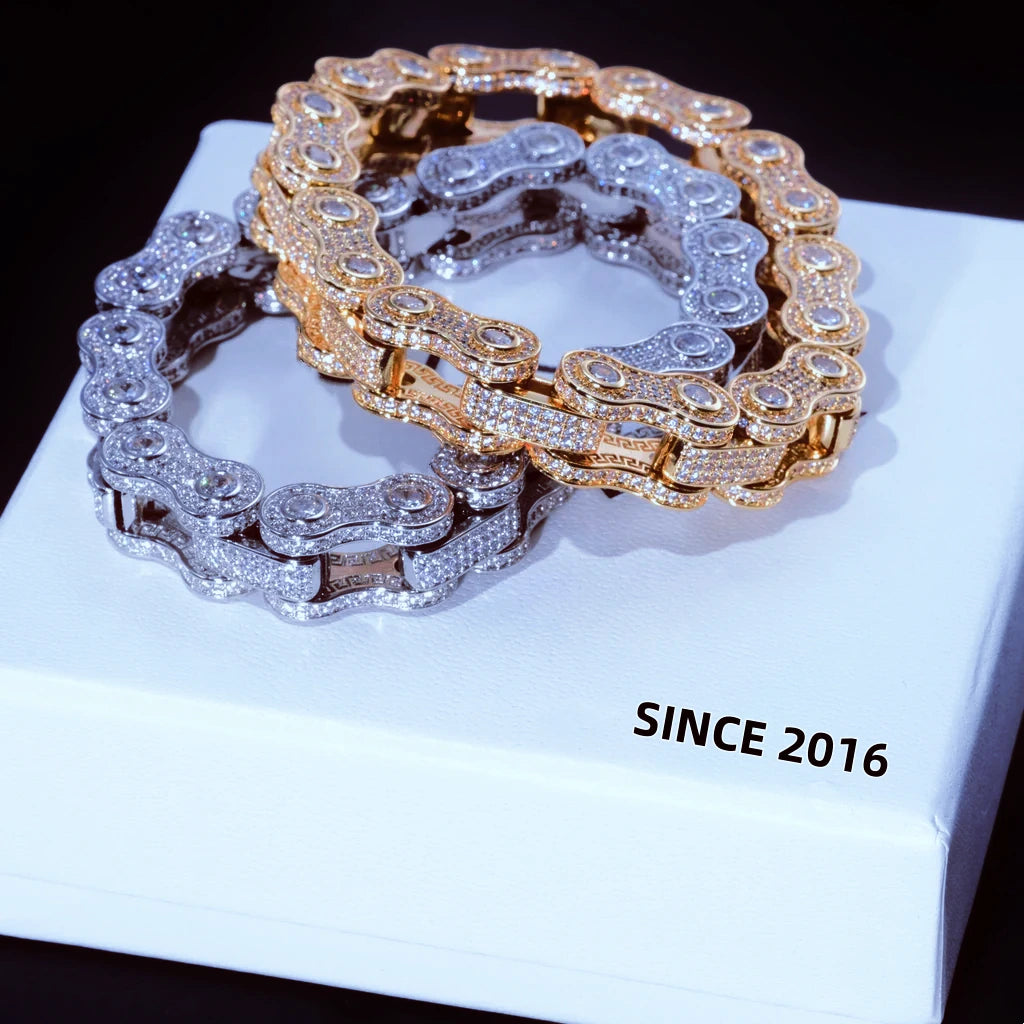 11mm full iced out bike chain link bracelet stack display, 18k gold plated and white gold plated two color motorcycle biker wrist jewelry, fully encrusted flawless VVS simulated diamonds hand-set without glue for maximum bling shine, two bracelets layered on clean white brand gift box printed SINCE 2016, heavy drip hip hop streetwear statement bracelet for men available in 7 inch and 8 inch sizes luxury fashion men jewelry gift RDRIP JEWELRY
