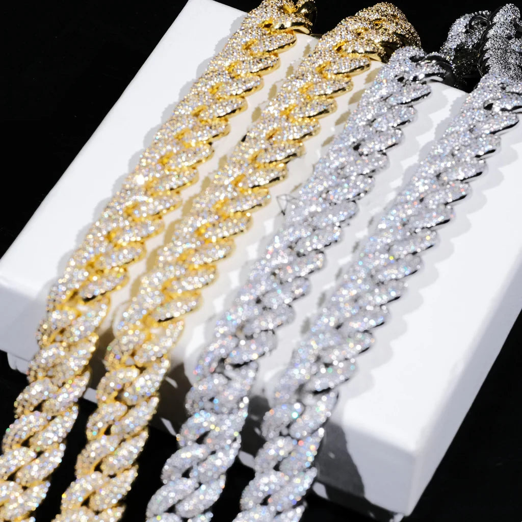 Slanted flat lay product comparison photo of four 14mm 3 row bubble dense fully encrusted iced miami cuban link chains two 18k yellow gold plated two white gold plated hand prong set flawless VVS simulated diamonds heavy chunky hip hop mens necklaces neatly arranged side by side on white branded jewelry box solid pure black background ultra shiny reflective stone details high resolution bling street rapper gift set showcase RDRIP JEWELRY
