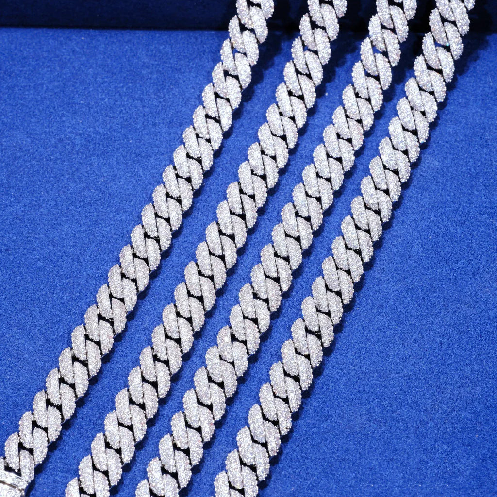 Macro close up shot of four strands 10mm full iced out silver miami cuban link chains side by side, fully pave set flawless VVS grade simulated diamond stones, shiny reflective bling surface, solid matte black textured background, 18K white gold plated stainless steel hip hop men necklace, hand prong encrusted flood ice cuban jewelry, multiple size layered cuban chain product detail shot, premium streetwear rap statement bling accessories for men from RDRIP JEWELRY

