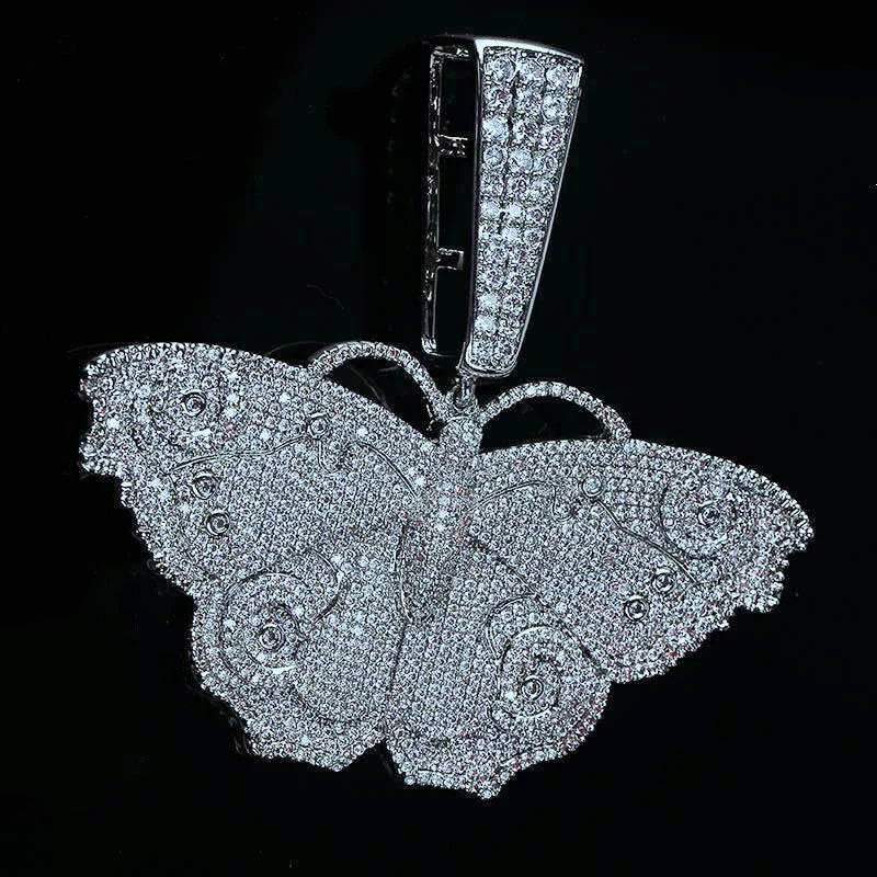 Full Iced Out Silver Vintage Butterfly Pendant glamour close‑up shot against deep solid black background, fully micro pave VVS grade AAA cubic zirconia stones, intricate wing carving details, open bail design for thick hip hop chains, premium bling streetwear rapper pendant for men and women RDRIP JEWELRY SINCE 2016
