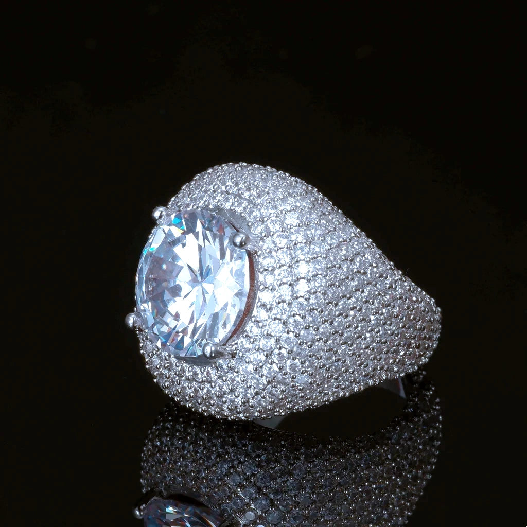 Men hip hop Glory Dome Iced Clustered Band Ring profile view, large round brilliant cut center stone, layered micro pave hand‑set VVS flawless simulated diamonds dome band, 18K white gold plated heavy bling statement ring for men, luxury hip‑hop jewelry on black reflective background RDRIP JEWELRY
