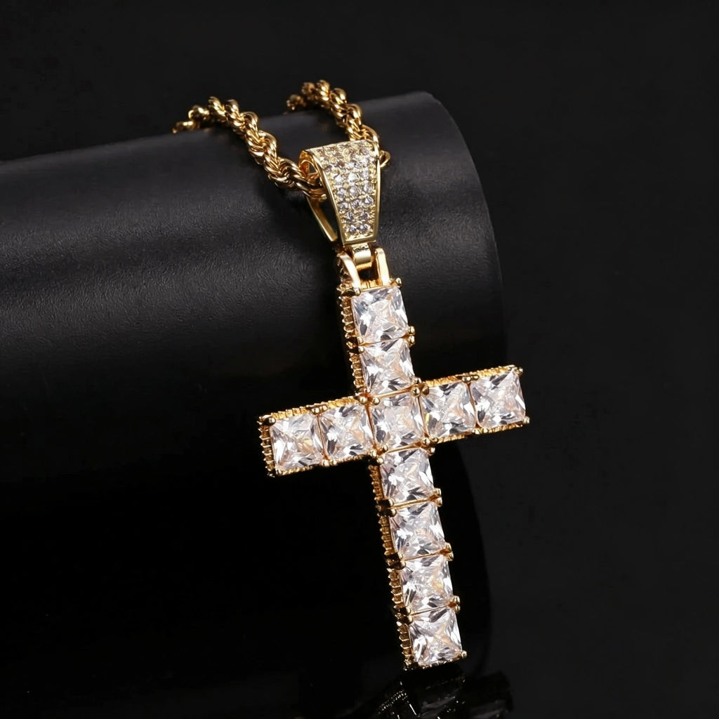18k gold plated baguette cut iced cross pendant close‑up studio photo, vvs simulated diamond cross necklace paired with twisted rope chain, hip hop religious men jewelry placed on black leather display tube against dark background RDRIP JEWELRY
