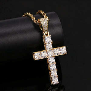 18k gold plated baguette cut iced cross pendant close‑up studio photo, vvs simulated diamond cross necklace paired with twisted rope chain, hip hop religious men jewelry placed on black leather display tube against dark background RDRIP JEWELRY
