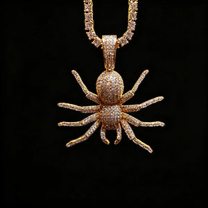 Gold Iced Tarantula Spider Pendant hanging shot with round stone tennis chain against solid black background, fully micro paved flawless VVS simulated diamonds, detailed eight‑leg spider hip hop necklace for men, premium bling streetwear jewelry RDRIP JEWELRY
