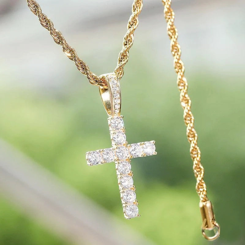 gold toned 925 sterling silver bling classic cross pendant with full rope chain and visible clasp, encrusted with brilliant vvs simulated diamonds, outdoor bokeh background shot, iced religious hip hop necklace for men RDRIP JEWELRY
