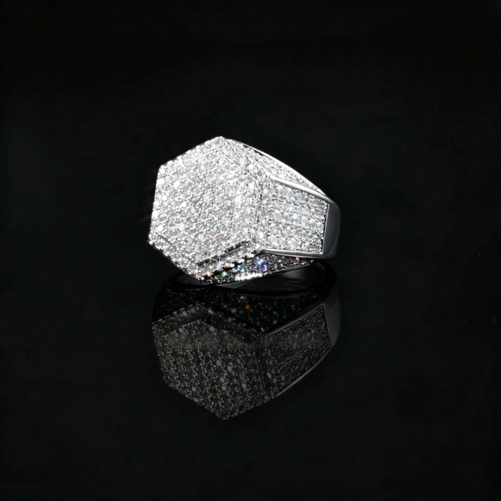 Silver finish men hip hop hexagon signet ring full micro‑inlay pave set sparkling cubic zirconia stones icy bling geometric hexagonal rapper statement ring polished silver metal close‑up product photo with reflection on black glossy background RDRIP JEWELRY
