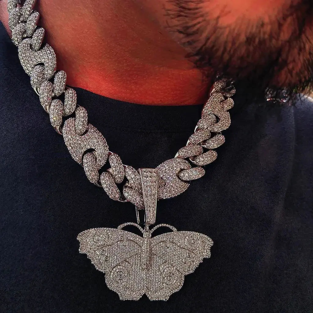 Iced Out Large Vintage Butterfly Pendant real men wear close up shot, fully micro pave AAA cubic zirconia hip hop pendant matched with heavy iced cuban chain, 18k gold plated copper bling street rapper necklace for men RDRIP JEWELRY SINCE 2016
