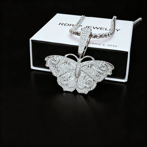 Iced Out Large Vintage Butterfly Pendant side shot placed with RDRIP branded gift box, full pave AAA cubic zirconia micro inlay hip hop bling charm, 18k gold plated copper statement necklace for men and women RDRIP JEWELRY SINCE 2016
