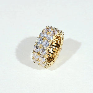 Iced micro pave double row gold plated band ring on light white background, hand‑set prong‑lifted cubic zirconia full icy eternity ring for men women, brilliant sparkling bling hip‑hop statement jewelry ideal for streetwear club and daily wear RDRIP JEWELRY
