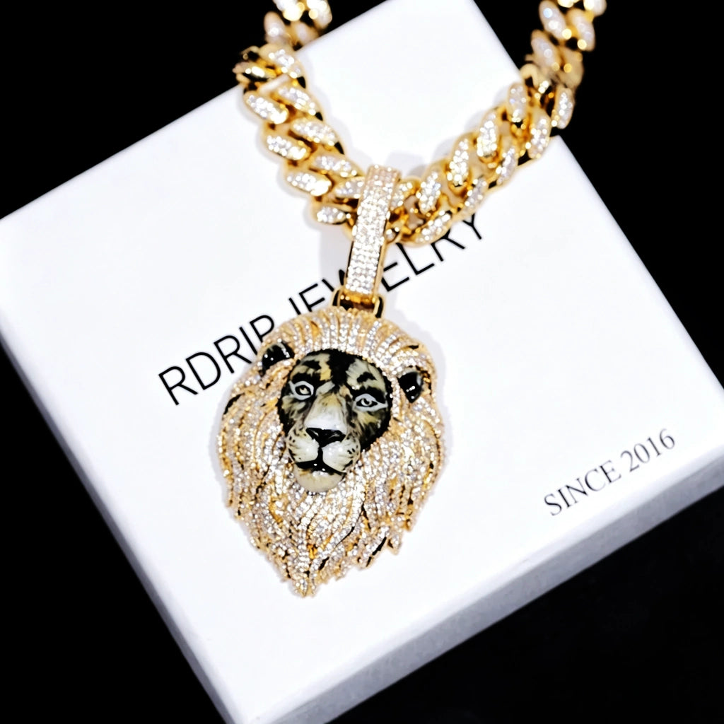 Gold iced out 3D enamel painted lion king pendant placed on branded gift box, realistic hand‑painted lion face, full vvs simulated diamond encrusted mane, hip hop men statement jewelry RDRIP JEWELRY
