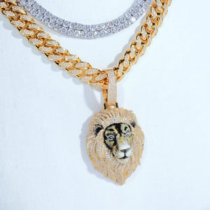 Gold iced out 3D enamel painted lion king pendant layering look, worn with iced cuban link chain and silver tennis chain on white cotton t shirt, realistic hand‑painted lion face, full vvs simulated diamond encrusted mane, trendy men hip hop layered necklace jewelry RDRIP JEWELRY
